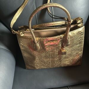 Michael Kors. golds-bronze handbag used  only 1-2 times, in pristine shape.